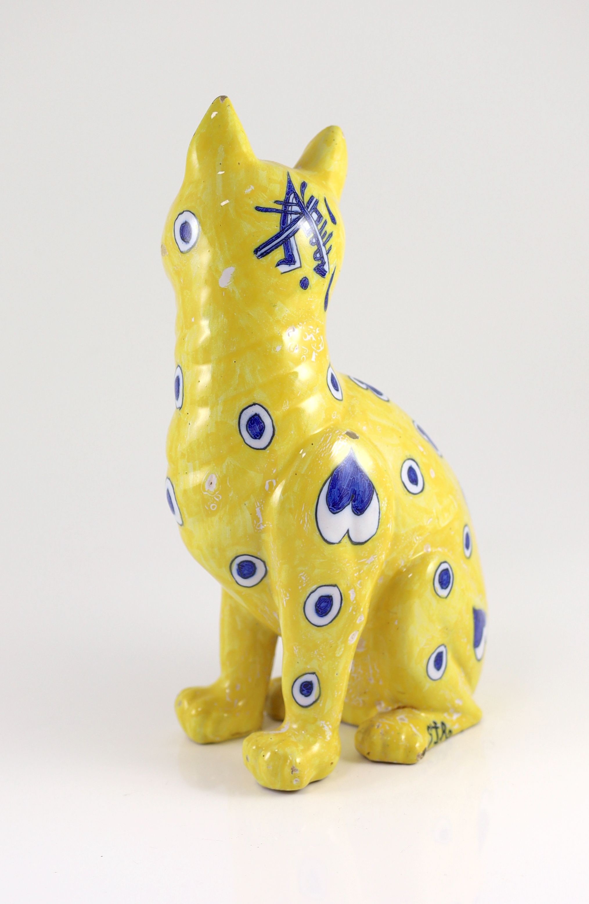 A Gallé yellow faience model of a seated smiling cat, c.1885, 33cm high, small faults